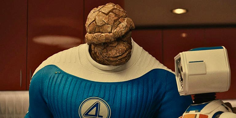 A scene from Fantastic Four: First Steps - the Thing, a rocky creature in a blue costumes, speaks to HERBIE, a small adorable robot